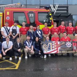Group photo with fire engine outside Village Gym