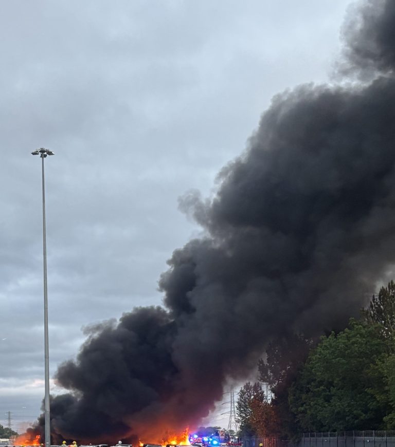 smoke plume at vehicle storage fire